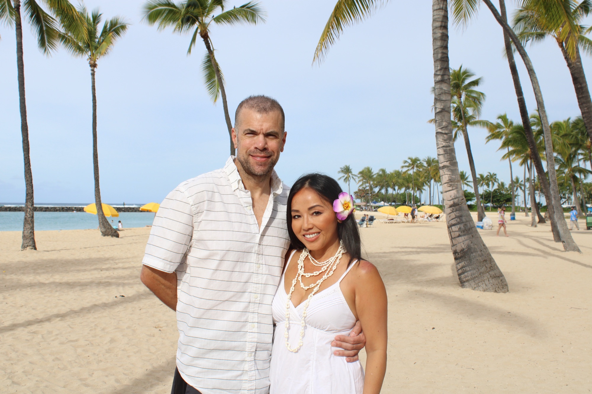 Steve and Julie, your hosts, on a palm-lined beach