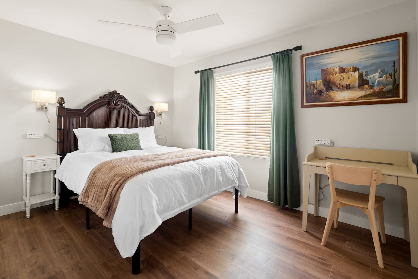 Bedroom 3 at South Mountain Vista: a queen bed with a camel throw, green curtains and a work desk by the window