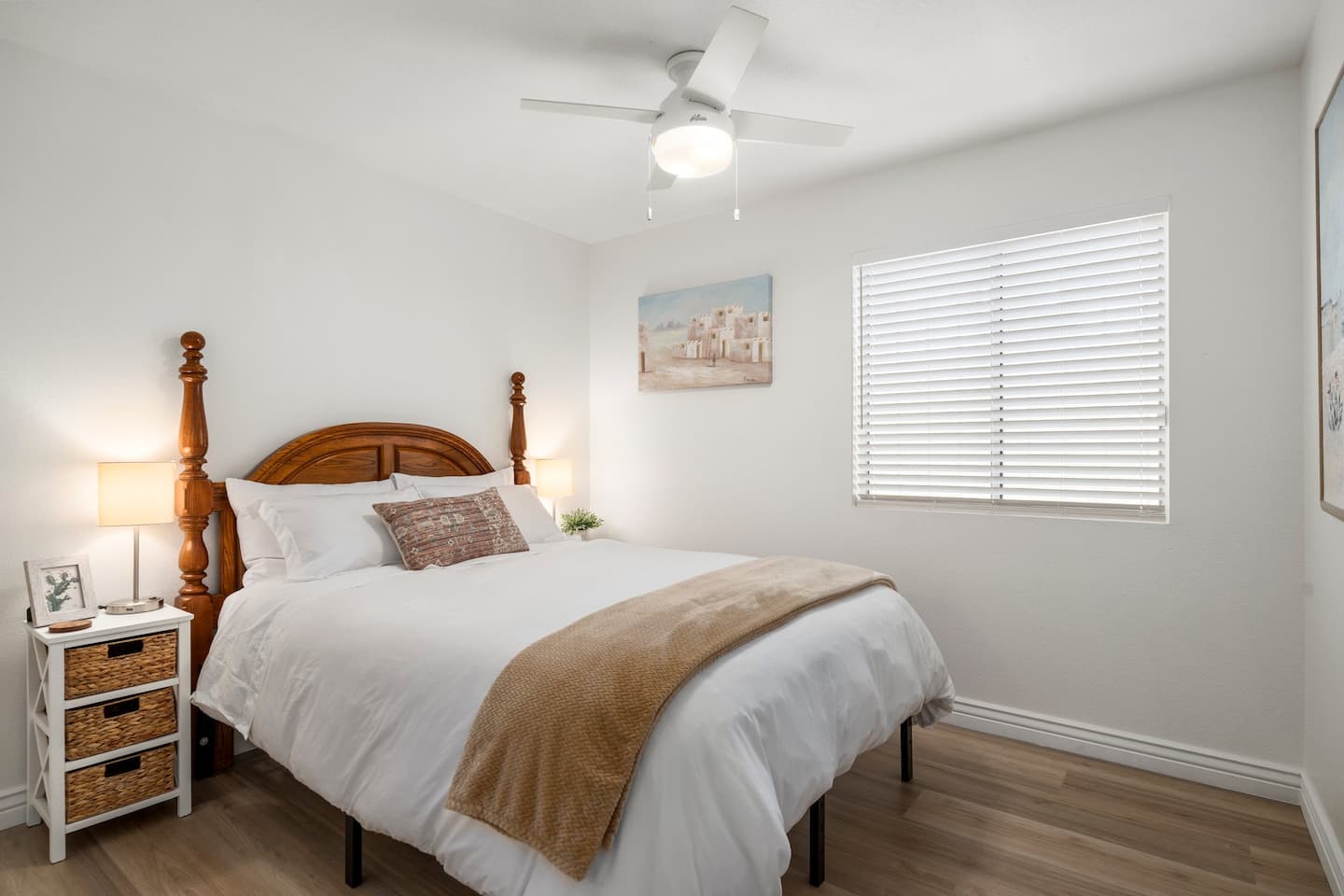 Bedroom 2 at South Mountain Oasis: a queen four-poster bed with white linens and a camel throw